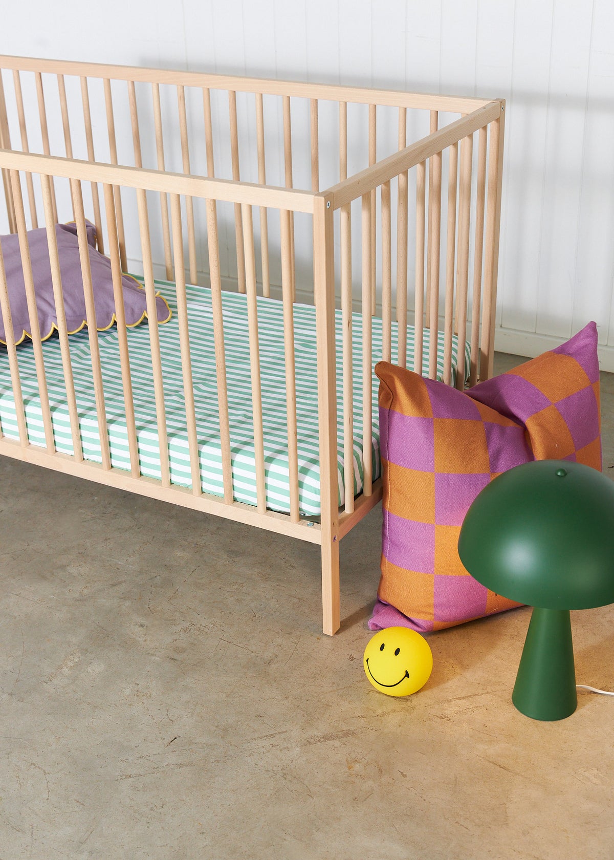 Organic Peach waterproof fitted sheet on a child's single bed